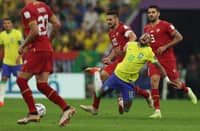 Brazil's forward #10 Neymar (2nd R) is tackled by Serbia's forward #10 Dusan Tadic (3rd R) during the Qatar 2022 World Cup Group G football match between Brazil and Serbia at the Lusail Stadium in Lusail, north of Doha on November 24, 2022. Photo by Adrian DENNIS / AFP