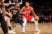 CJ McCollum of the New Orleans Pelicans dribbles the ball during the game against the Memphis Grizzlies. Photo by Ned Dishman / NBAE / Getty Images / Getty Images via AFP
