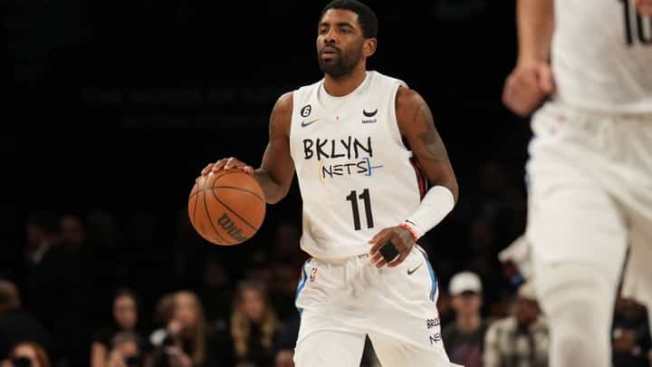 Kyrie Irving of the Brooklyn Nets dribbles the ball during the game against the Memphis Grizzlies on November 20, 2022 at Barclays Center in Brooklyn, New York. Photo by Jesse D. Garrabrant / NBAE / Getty Images / Getty Images via AFP