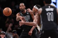 Kevin Durant passes the ball to Kyrie Irving of the Brooklyn Nets during the fourth quarter of the game against the Indiana Pacers at Barclays Center on October 31, 2022 in New York City. Photo by Dustin Satloff / GETTY IMAGES NORTH AMERICA / Getty Images via AFP