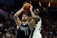 Doncic triple-double carries Mavs past Warriors