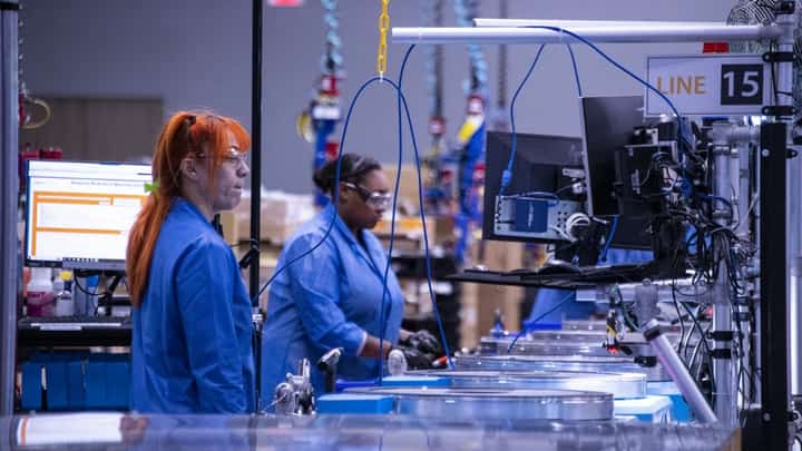 Employees build and test robots at Amazon's BOS27 Robotics Innovation Hub in Westborough, Massachusetts on November 10, 2022. The robotics laboratory of the US e-commerce giant is developing the automation of its distribution centers around the world so that customers receive their orders efficiently in the shortest possible time. (Photo by JOSEPH PREZIOSO / AFP)
