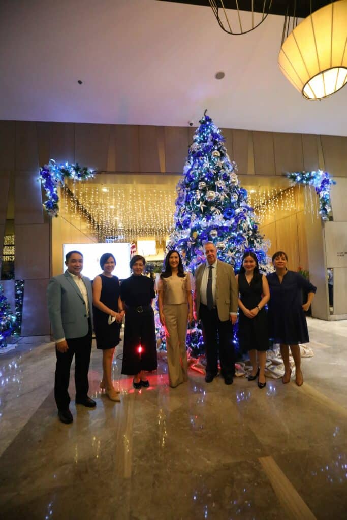 THE ceremonial tree-lighting of Seda Vertis North was graced by Mayor Joy Belmonte (fourth from right) and other officials of the Quezon City Tourism department.
