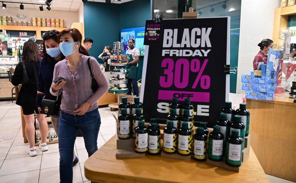 People shop during Black Friday in Santa Anita within the city of Arcadia, California on 25 November 2022. Inflation hovers over US shoppers this year as many hit the stores for the traditional day after Thanksgiving shopping sales. (Photo by FREDERIC J. BROWN / AFP)