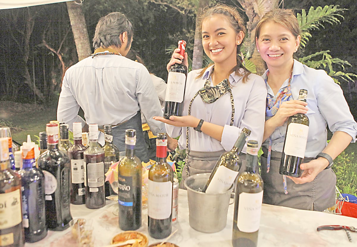 OVERFLOWING drinks at Spain's National Day celebration.