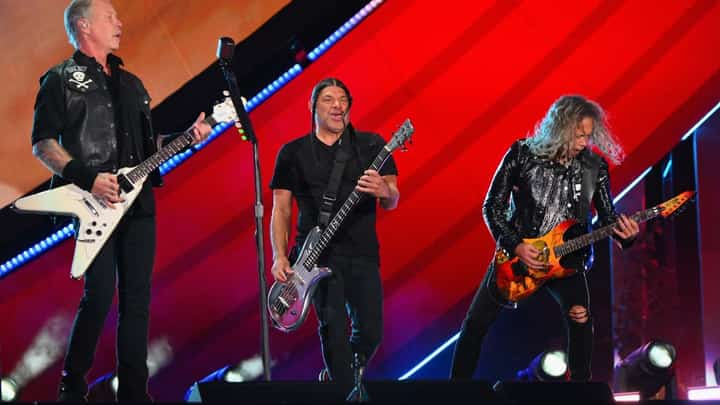 James Hetfield (left), Robert Trujillo (center), and Kirk Hammett (right) of Metallica perform during the Global Citizen Festival at Central Park in New York on 24 September 2022. (Photo by ANGELA WEISS / AFP)