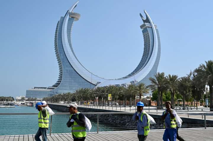 FILE PHOTO: In the background is the Katara Towers in the Qatari coastal city of Lusail. (Photo by GABRIEL BOUYS / AFP)