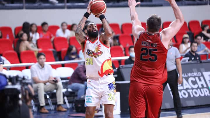 Ryan Pearson of Rain or Shine shoots a jumper against Cameron Krutwig of Blackwater in their PBA Commissioner’s Cup game yesterday at the Philsports in Pasig. | Photograph COURTESY OF PBA