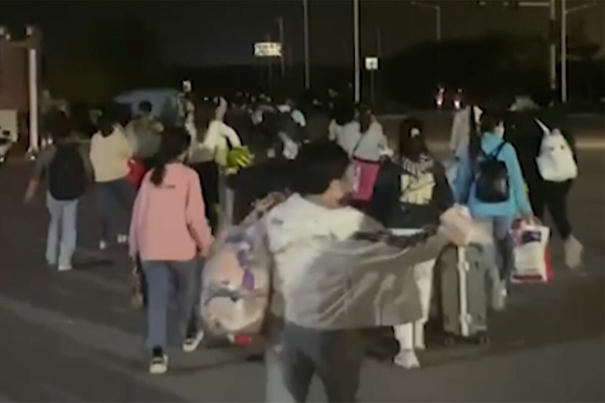 iPhone factory under lockdown boosts bonuses for workers who stay