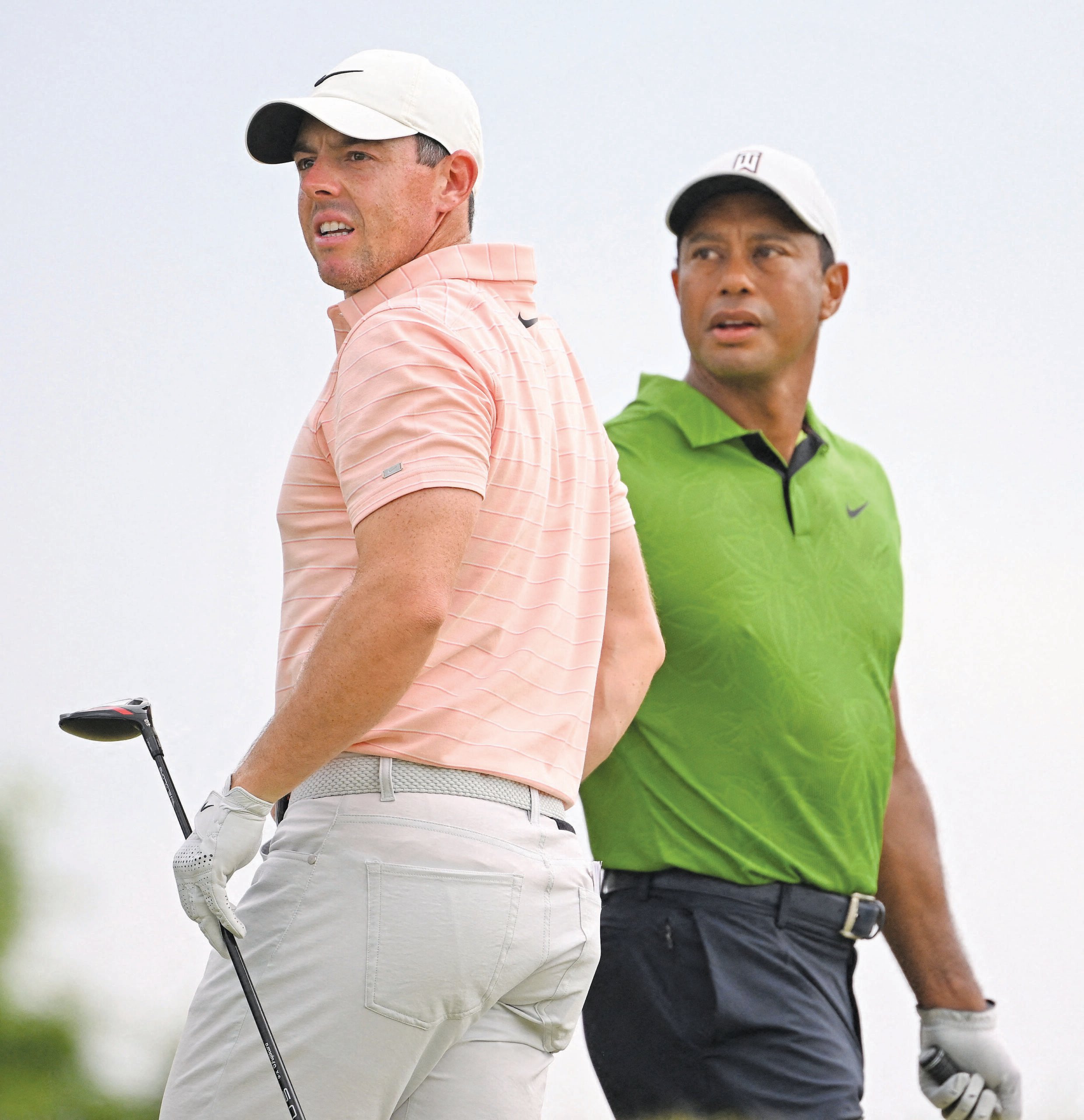 Tiger Woods (right) and Rory McIlroy will team up against Justin Thomas and Jordan Spieth in an exhibition 12-hole match on 10 December in Belleair, Florida. | ROSS KINNAIRD/AGENCE FRANCE PRESSE