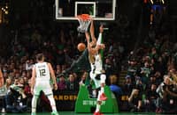 Jayson Tatum of the Boston Celtics dunks the ball during the game against the Milwaukee Bucks on December 25, 2022 at the TD Garden in Boston, Massachusetts. Photo by Brian Babineau / NBAE / Getty Images / Getty Images via AFP