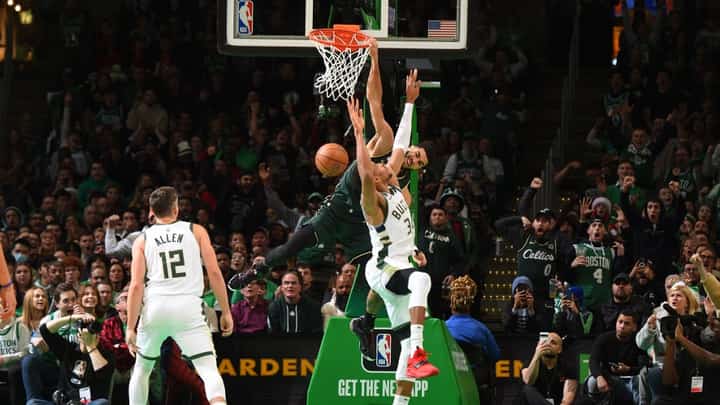 Jayson Tatum of the Boston Celtics dunks the ball during the game against the Milwaukee Bucks on December 25, 2022 at the TD Garden in Boston, Massachusetts. Photo by Brian Babineau / NBAE / Getty Images / Getty Images via AFP