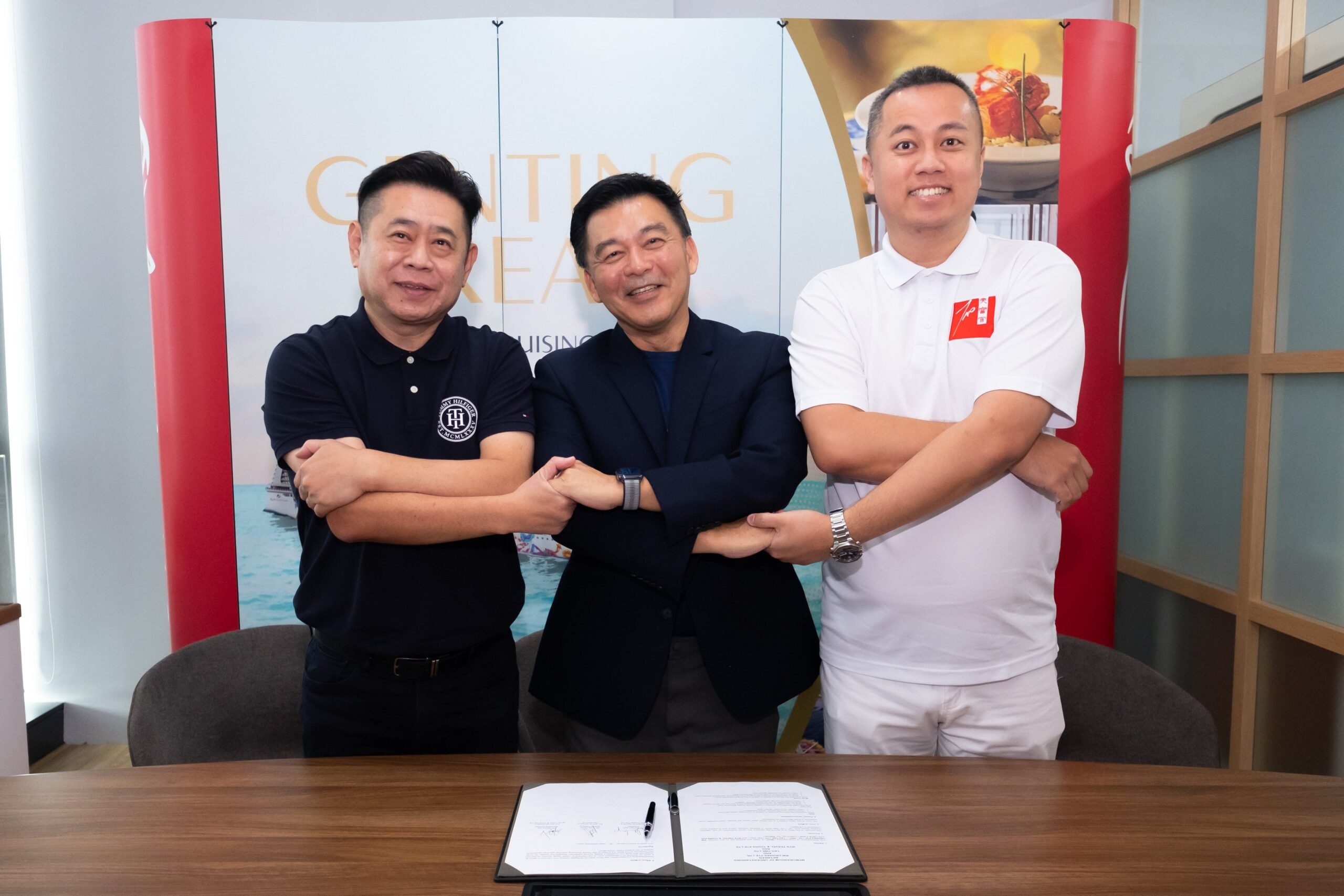 Michael Goh, president, Resorts World Cruises (center) and Andy Wong, director general, Tao One Ltd (right) and Micker Sia, managing director, WTS Travel &amp; Tours Pte Ltd (left) signed the MoU at the Resorts World Cruises headquarters in Singapore to launch the first lion dance competition at sea on the Genting Dream.