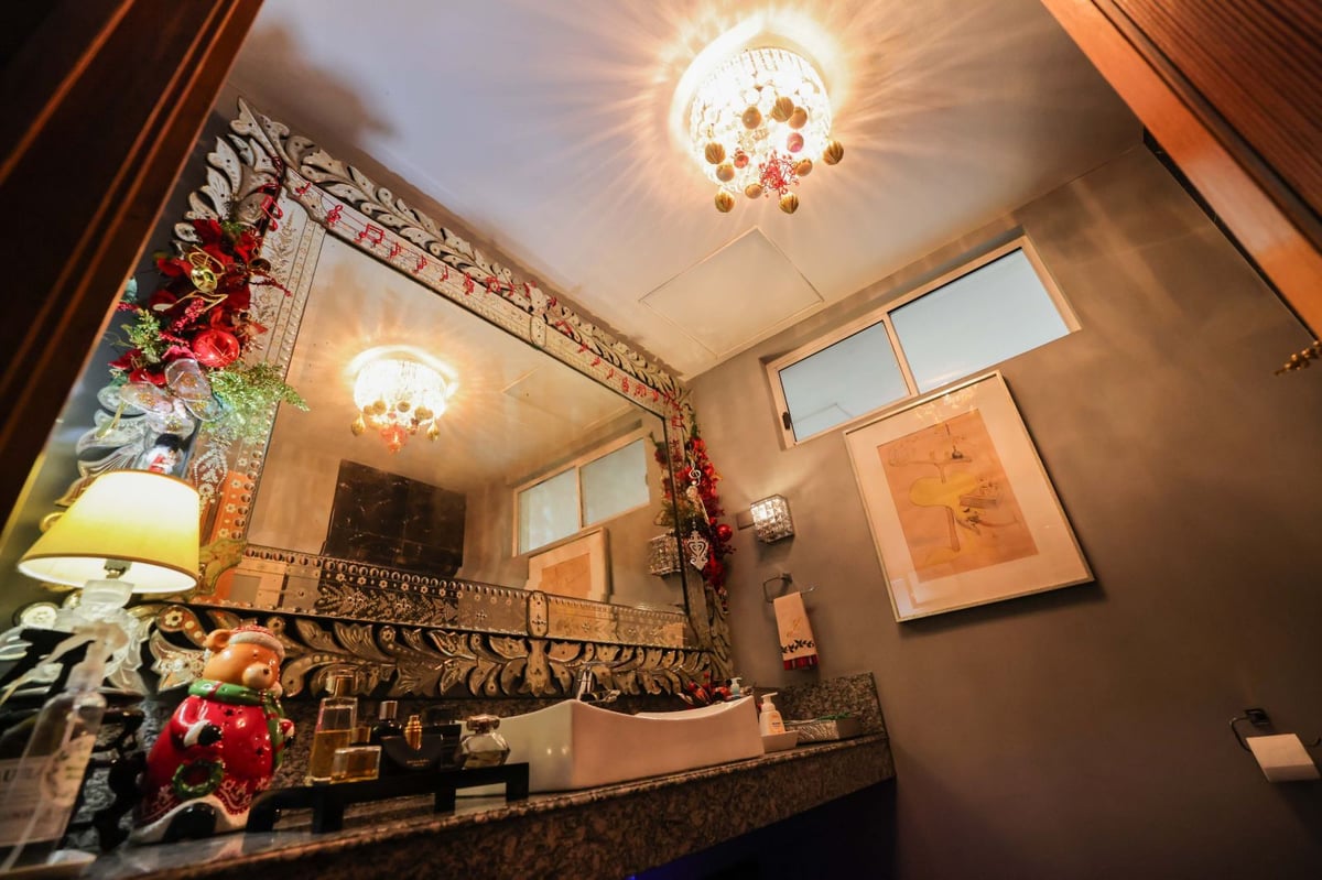 The ladies' room is sprinkled with holiday ornaments.
