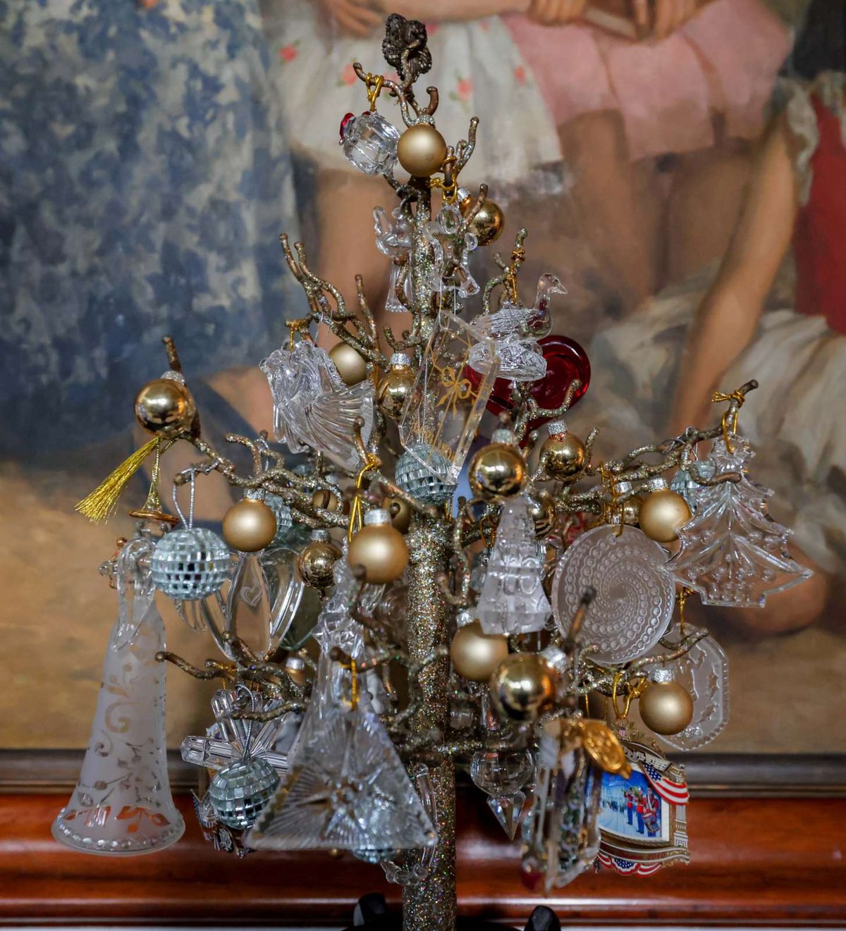 A miniature Christmas tree of crystal, china and other collectibles, gifts of diplomat friends, is a sure conversation piece