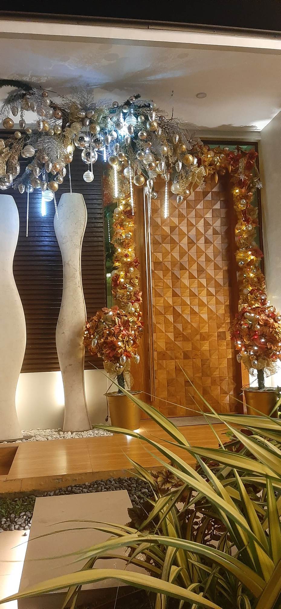 CHRISTMAS wreath frames the Palejas' main door.