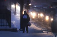 Heavy snow and howling winds upended holiday plans at one of the busiest times of the year, as a huge cold front swept down from the Arctic and took freezing hold of the middle of the country. (Photo by SCOTT OLSON / Getty Images / AFP)