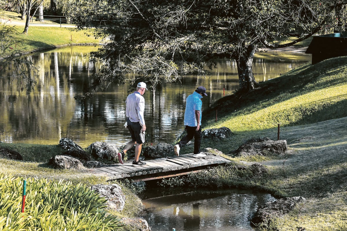 Danilo Cruz of Luisita Golf and Country Club (front) and Chris Howard of Mamala Bay on their way to hole 13 at Camp John Hay in Baguio | Photo by Rio Deluvio
