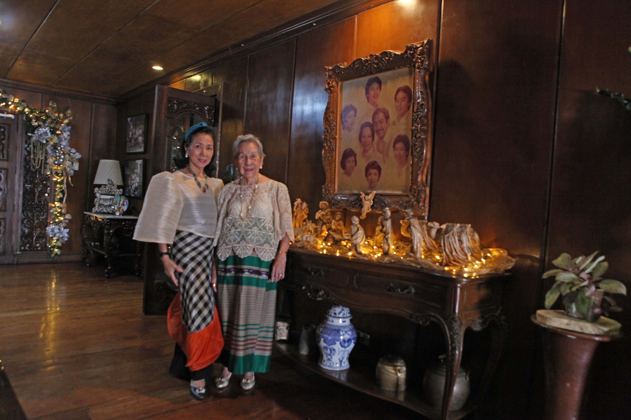 DITTA Sandico and mother pose by their decades-old manger.