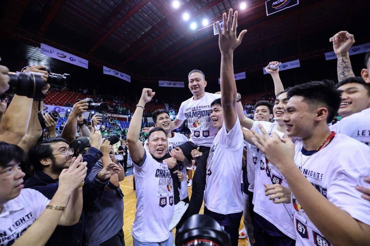 LETRAN Knights give their coach, Bonnie Tan, a victory ride for leading them to the NCAA Season 98 title.