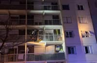 This handout picture released by ASSED shows firefighters at work in a building of the Mas-Du-Taureau neighborhood where a fire caused many victims, including children, in Vaulx-en-Velin, east of Lyon, southeastern France, on 16 December 2022. (Photo by ASSED / ASSED / AFP)