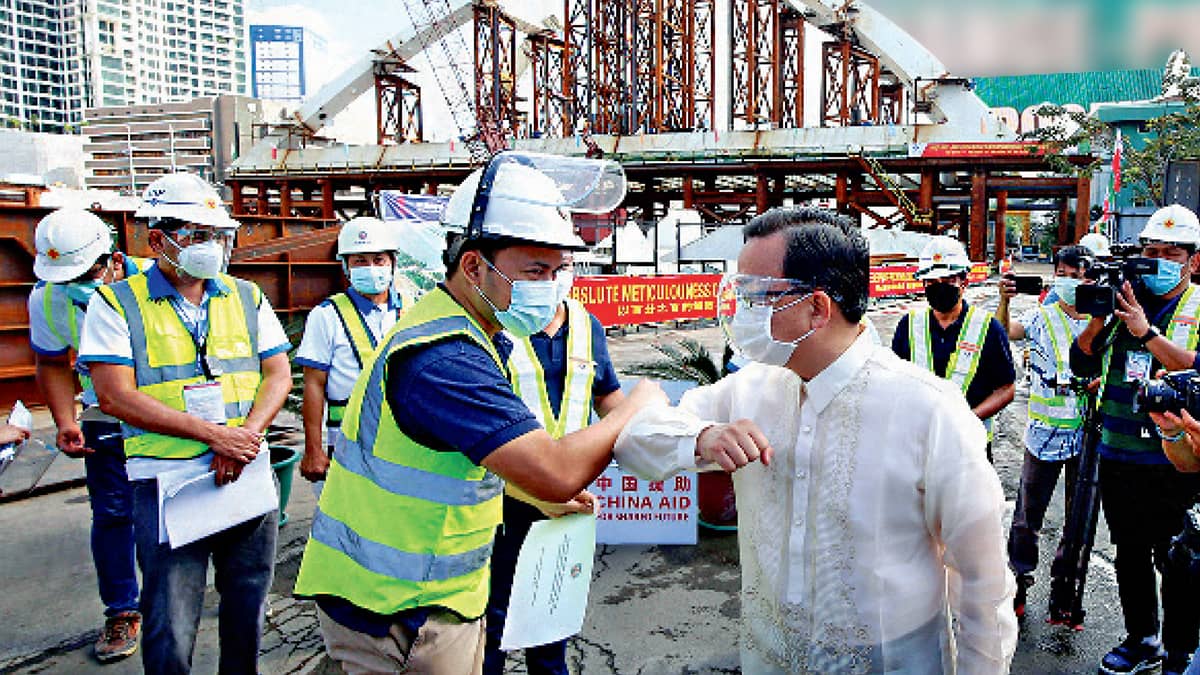 DUTERTE administration Public Works secretary Mark Villar and Chinese Ambassador Huang Xilian do a site inspection of bridge to ensure its timely completion