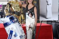 Actress Billie Lourd poses with Star Wars character R2D2 and C3PO during the ceremony for her mother Carrie Fisher being honored posthumously with a Star on the Hollywood Walk of Fame on 4 May 2023 in Hollywood, California. (Photo by VALERIE MACON / AFP)