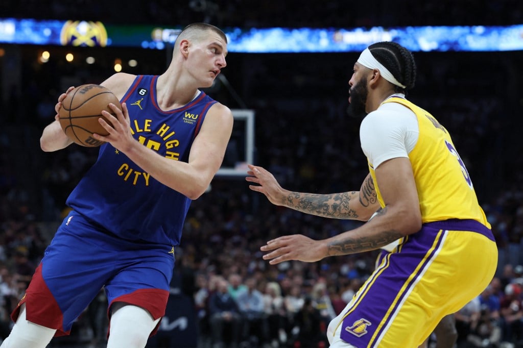 Nikola Jokic #15 of the Denver Nuggets looks to pass the ball against Anthony Davis #3 of the Los Angeles Lakers during the third quarter in game one of the Western Conference Finals at Ball Arena on 16 May. Photo by MATTHEW STOCKMAN / GETTY IMAGES NORTH AMERICA / Getty Images via AFP