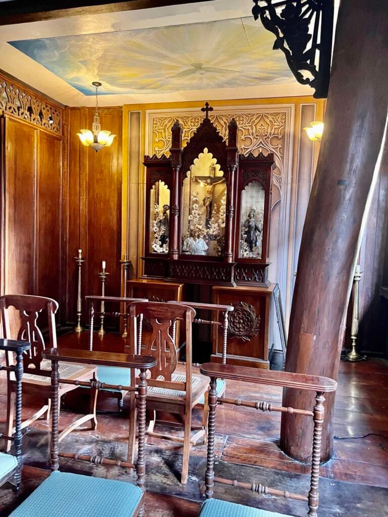 Whispered prayers A family capilla with visible hardwood trunks as structural support.