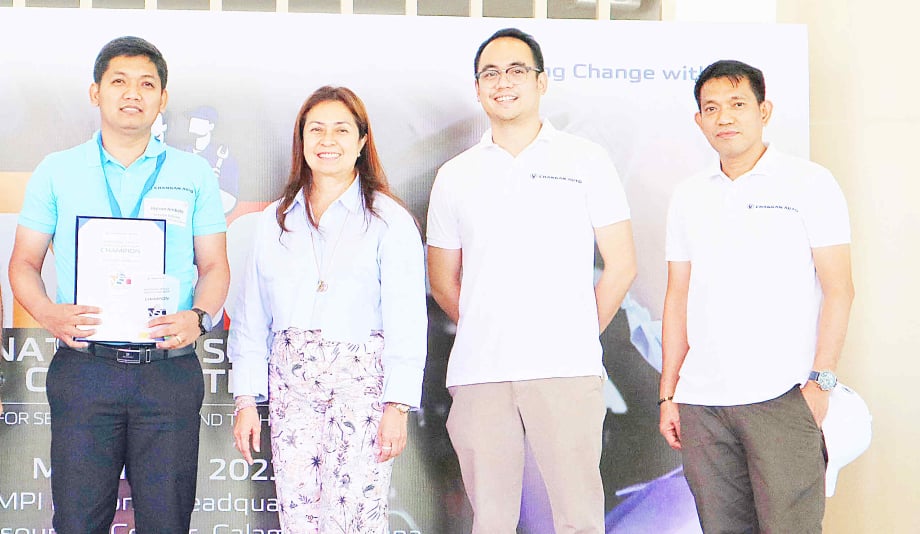 Jayson Ambata of Changan Santa Rosa (left) poses with (from left) CMPI president and CEO Maria Fe Perez-Agudo and executives Don David Agudo and Marvin Joaquin.