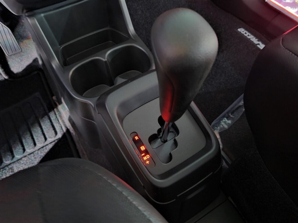 The Suzuki AGS system features a manual transmission that is electronically actuated, removing the need for a clutch.