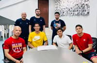 HEAD coach Yeng Guiao (left) and the Rain or Shine executives welcome Mac Belo (second from left) after signing a one-year deal.