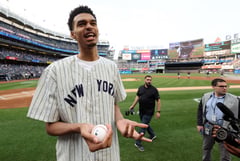 Likely NBA top pick Wembanyama throws baseball with Yankees