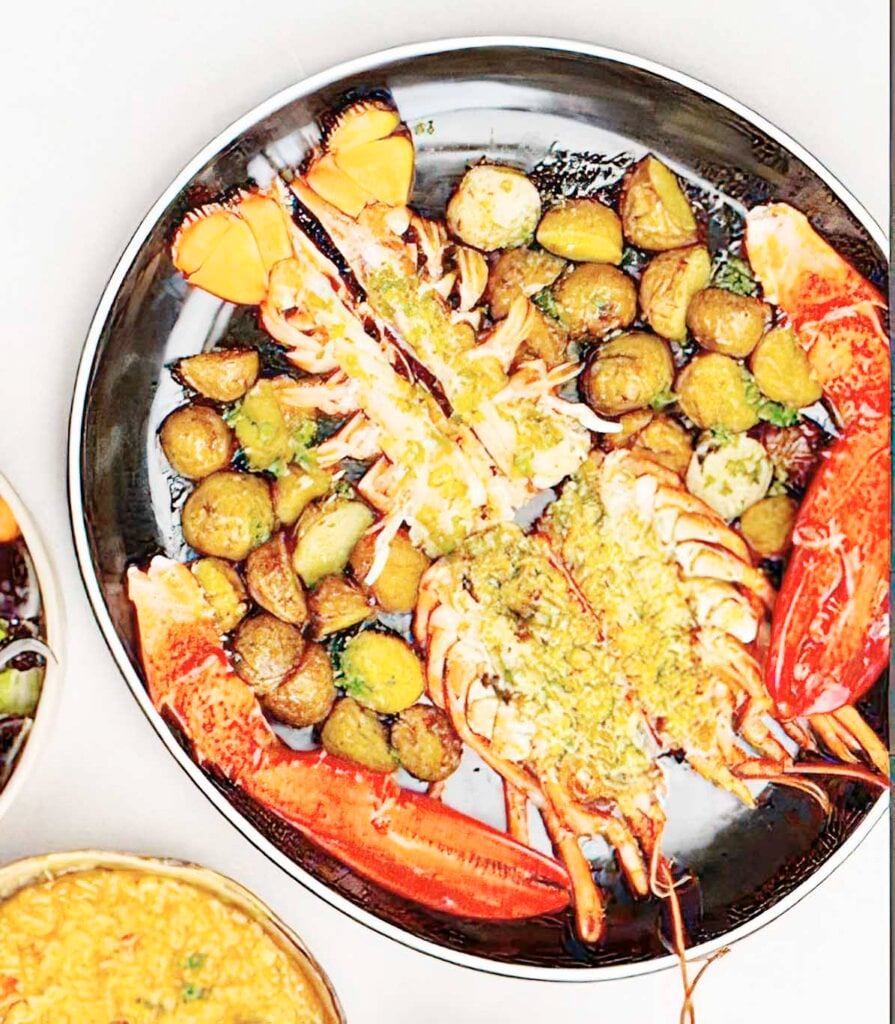 Charcoal Grilled Lobster served with Lobster Rice, Lemon Butter sauce and Tagaytay Green Salad.