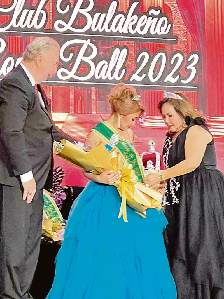 photographS COURTESY OF ANGEL FENTON<br />Parents Ian and Marissa Fenton pin the Club Bulakeño Muse sash on their daughter, Angel.