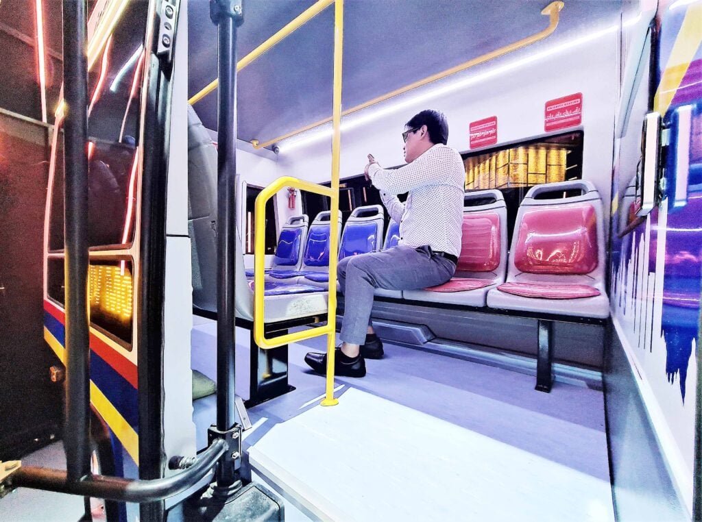 A party guest checks out the seating configuration behind the Tamaraw PUV concept. With the IMV-0 Platform, around 10 people can sit comfortably inside.