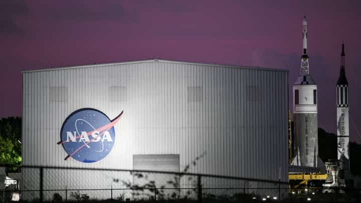 FILE PHOTO: NASA's logo is seen at Rocket Park during an Apollo 11 50th anniversary celebration at Space Center Houston on 20 July 2019, in Houston, Texas. (Photo by Loren ELLIOTT / AFP)