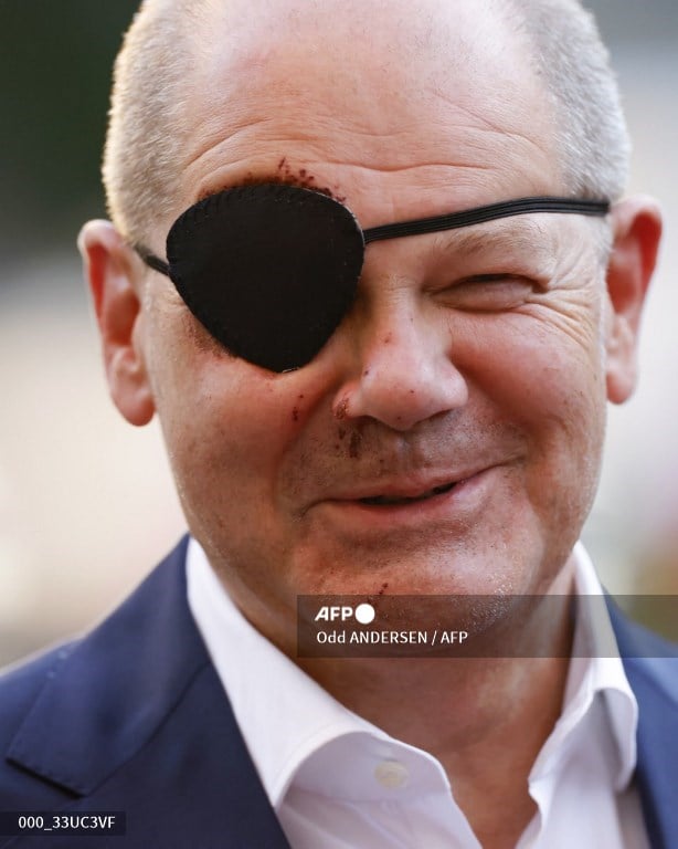 German Chancellor Olaf Scholz, wearing an eyepatch after injuring his face while jogging, attends the annual St Michael reception of the Catholic Church in Germany, in Berlin on 4 September 2023. Scholz suffered minor injuries after falling while out running on 3 September, forcing him to cancel some appointments that day. (Photo by Odd ANDERSEN / AFP)