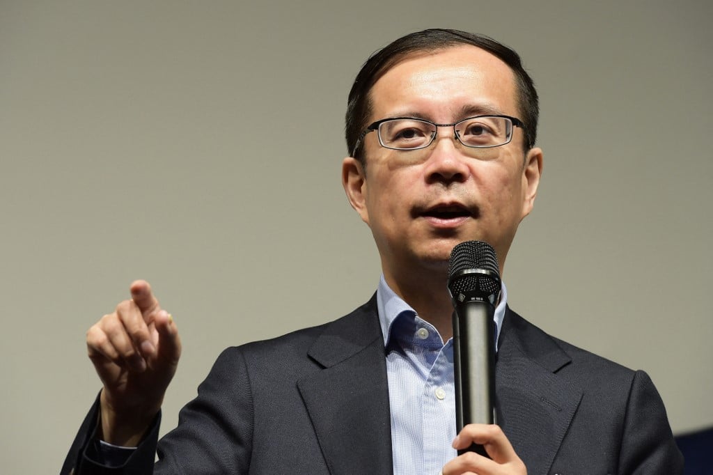 FILE PHOTO: Daniel Zhang, Alibaba Group CEO, delivers a speech. (Photo by NICOLAS TUCAT / AFP)