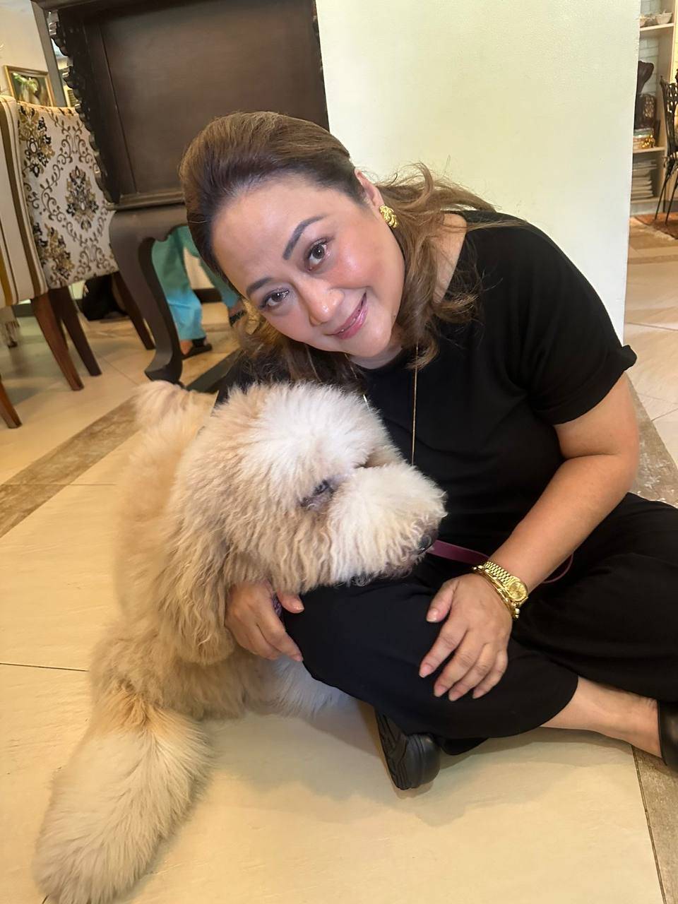 Chef Reggie Aspiras with her giant poodle Chucky