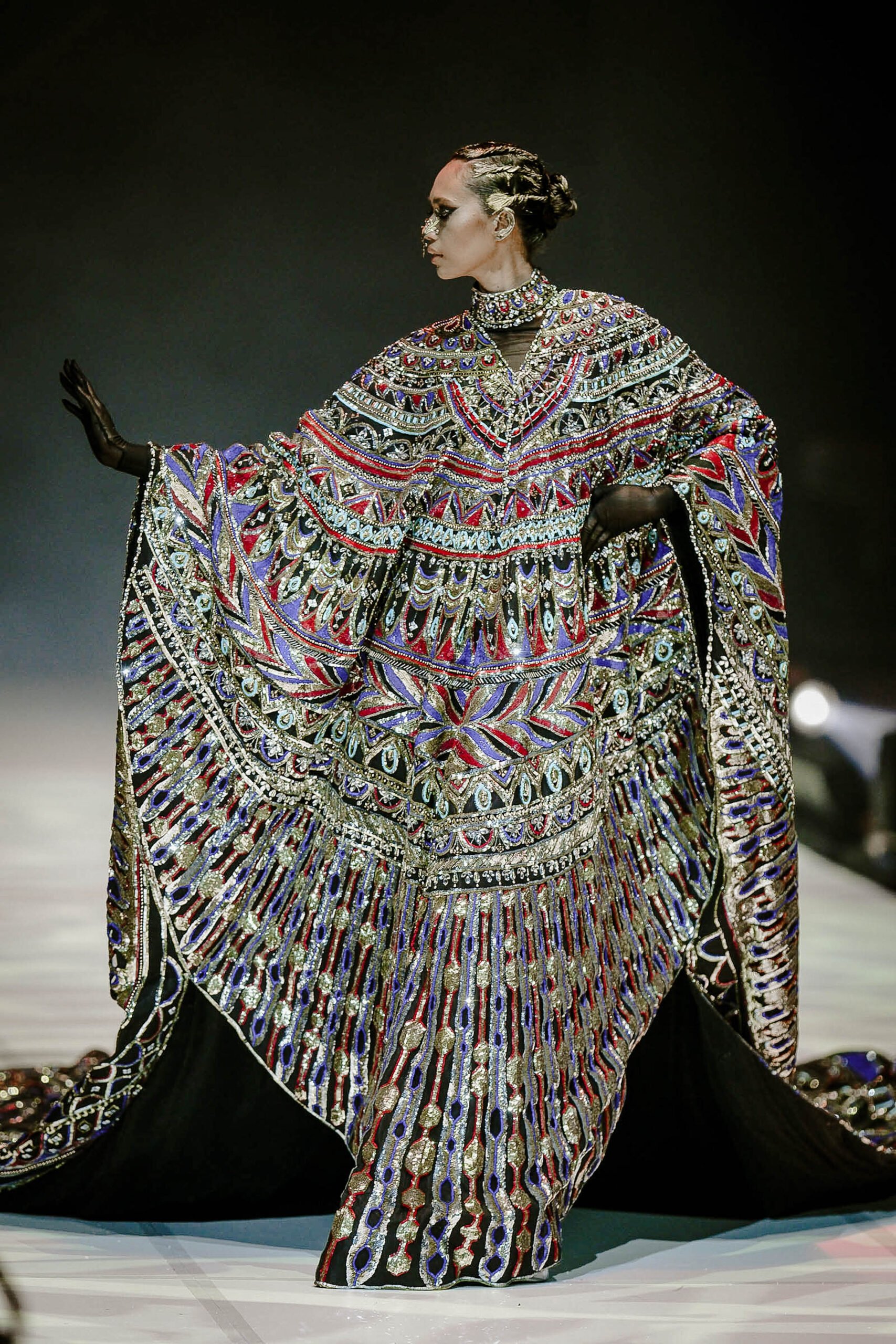 HIS creations cleverly combine soft, flowy fabric with shiny, metallic materials and accentuated with quirky accessories.