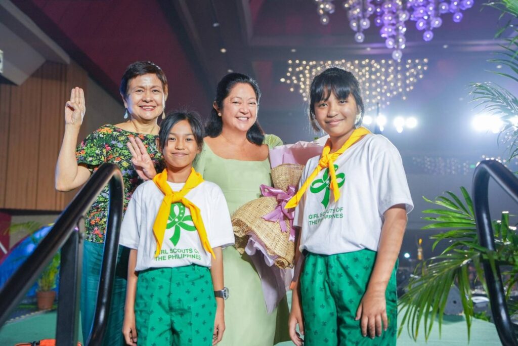 The First Lady Liza Marcos Araneta with GSP President Nina Lim Yuson, posing with young Girl Scouts, during the Camp Escoda Fundraising Ball.