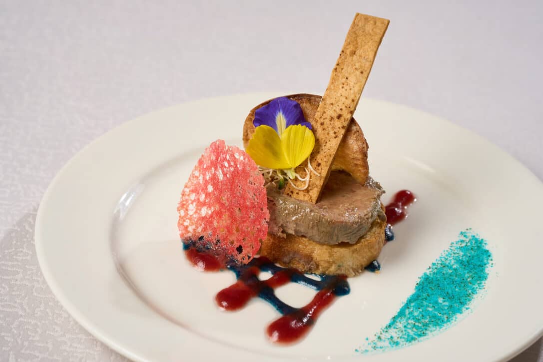 Chicken liver pate served with toasted baguette and a drizzle of cumberland sauce.