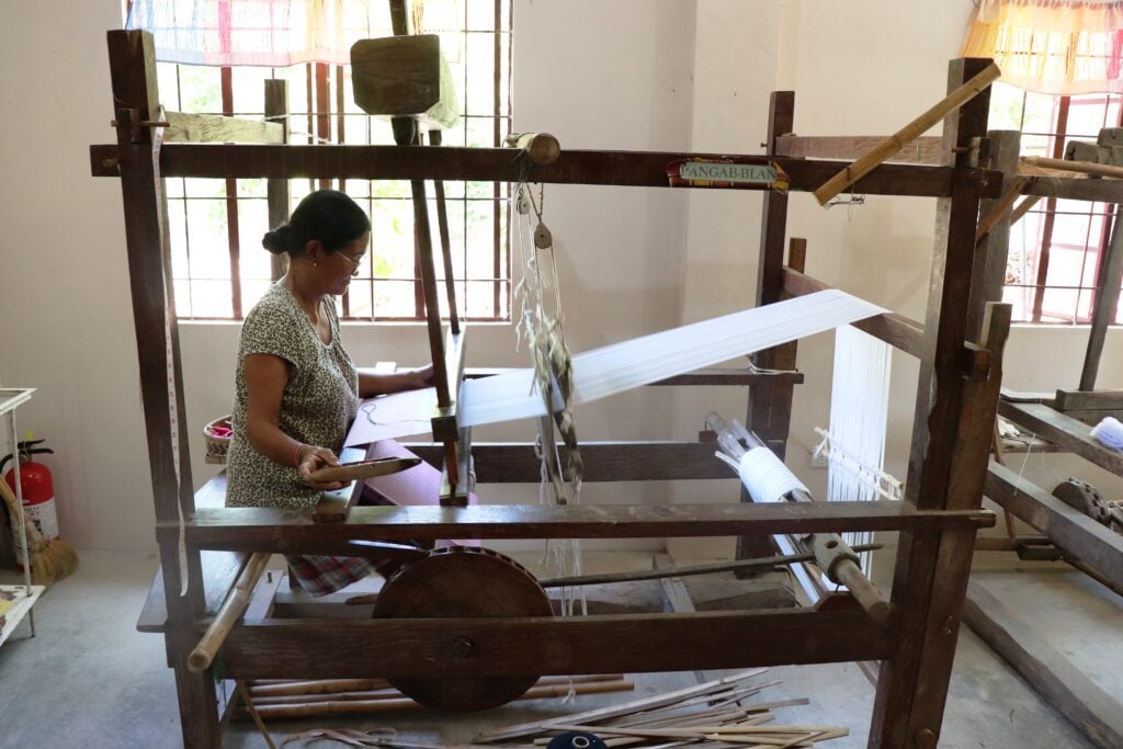 A weaver at work on an upright pedal loom in Paoay. | PHOTOGRAHS BY ROEL MANIPON FOR THE DAILY TRIBUNE