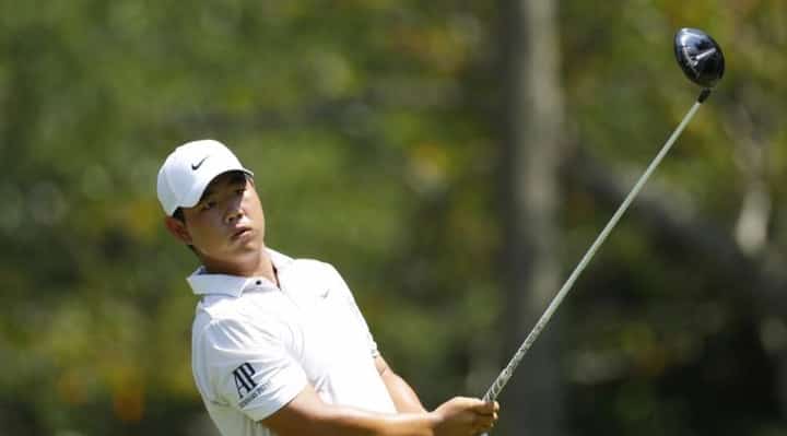 Late birdies fuel Kim surge