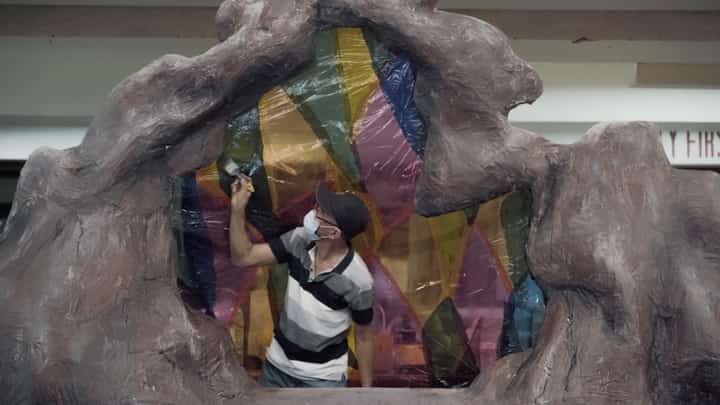 Manong Junior does what he does best — scenic painting.