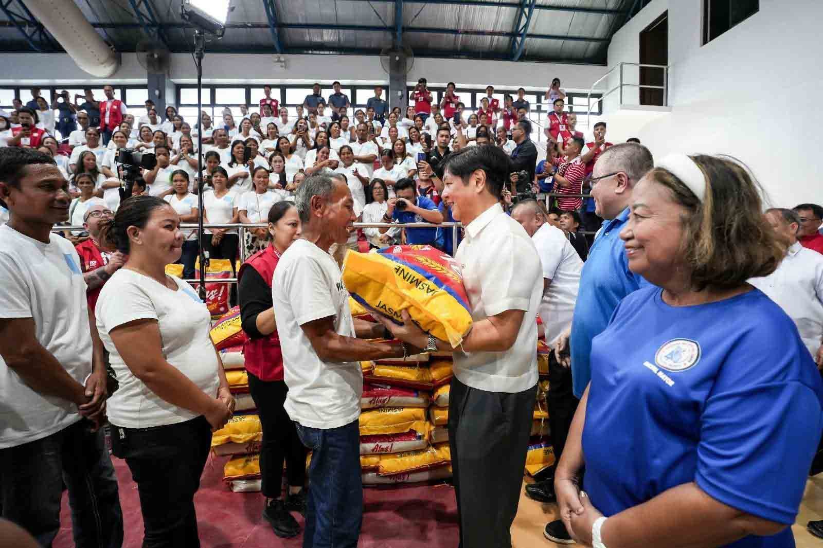 (FILES) President Ferdinand R. Marcos Jr. ensures that no one goes hungry as he personally oversees the distribution of food stamps and 25-kilo sack of rice to each 4Ps beneficiaries in Surigao del Norte on Friday.