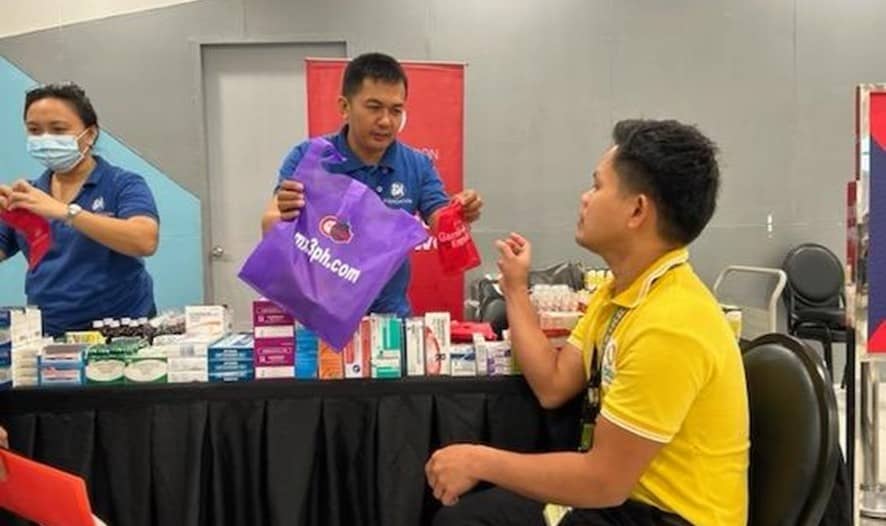 A resident gets free vitamins and medicine at SM Foundation's medical mission in SM City Butuan.