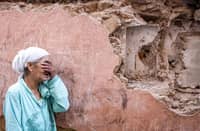 A woman reacts standing infront of her earthquake-damaged house in the old city in Marrakesh on September 9, 2023. A powerful earthquake that shook Morocco late September 8 killed more than 600 people, interior ministry figures showed, sending terrified residents fleeing their homes in the middle of the night.
FADEL SENNA / AFP