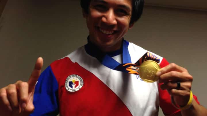 Daniel Caluag makes the No. 1 sign with his gold medal at the Athletes Village of the Incheon 2014 Asian Games on 1 October 2014. PHILCYCLING PHOTO